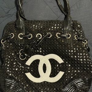 Black leather woven Chanel bag.